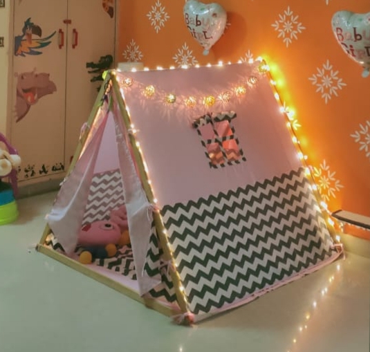 a pink play tent decorated for diwali